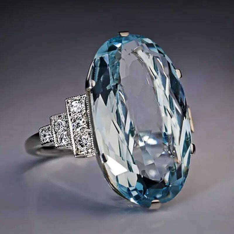 Huitan Female Light Sky Blue Wedding Ring Solitaire Band Oval Stone Engage Party Women Luxury Jewelry Shine CZ Stone Best Gift